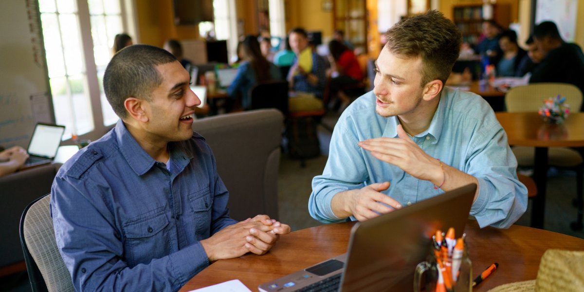 A wrtier and a Writing Adviser discussing a paper in the Writing Center