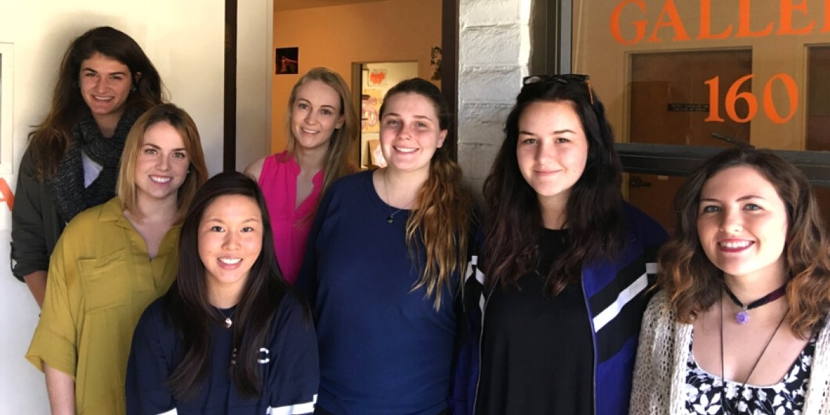 7 capstone students standing in front of gallery 160 