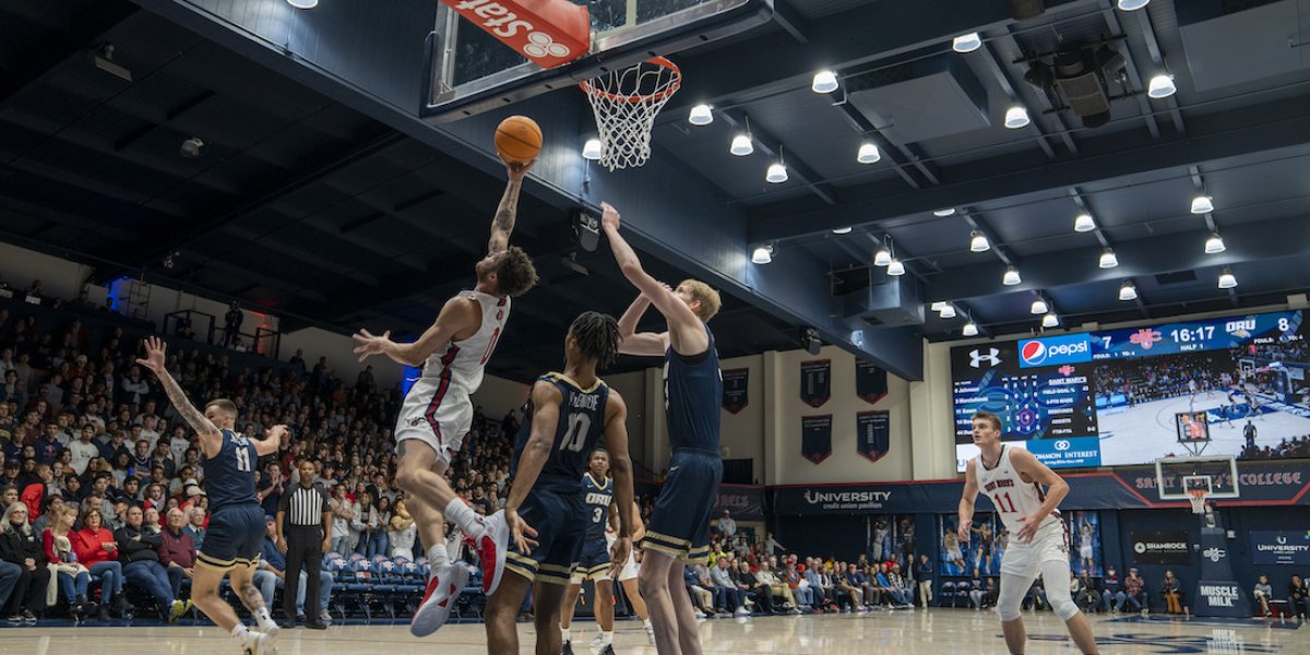 Logan Johnson lays up a shot 