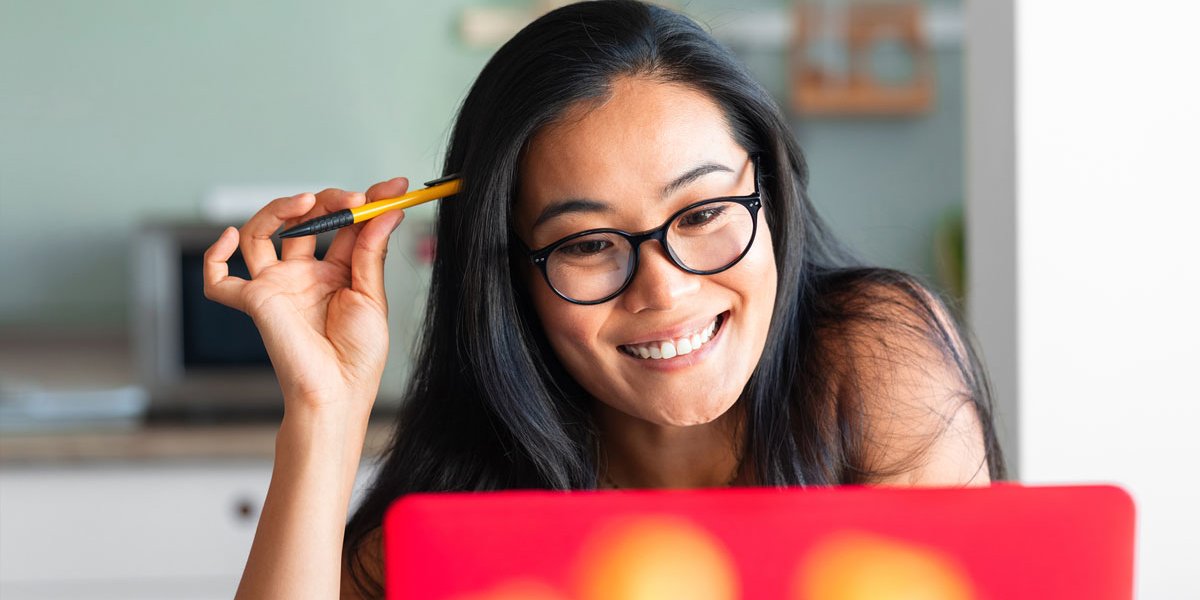 woman at laptop smiling
