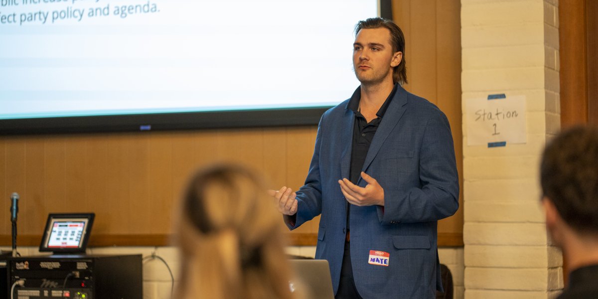 Student presenting at a conference