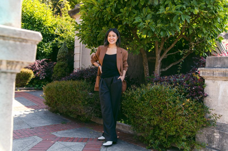 Sierra Nguyen stands in front of landscaping in San Francisco