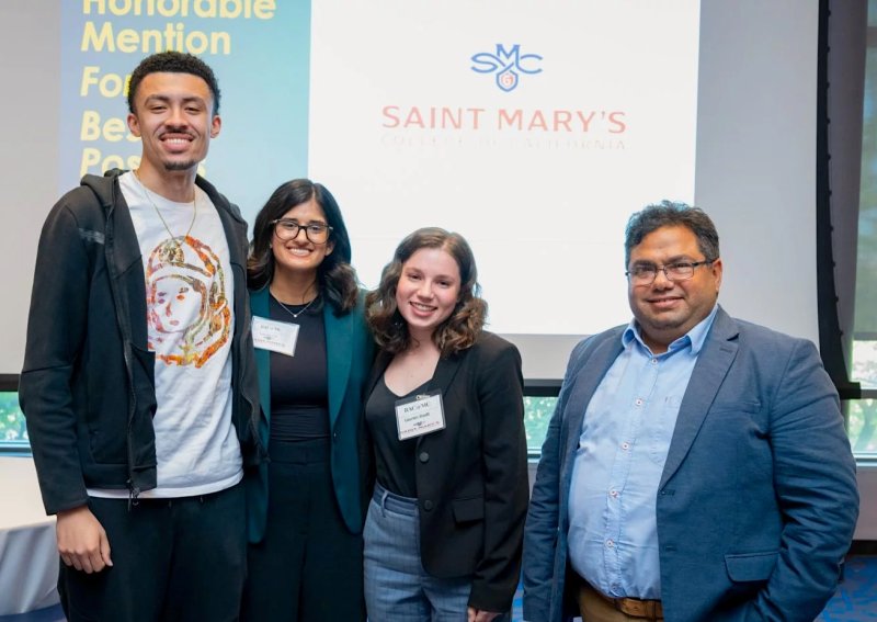 2024 Business Analytics Team in front of screen