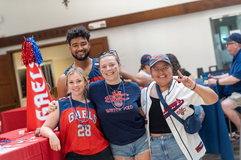 GaelForce members wearing SMC attire smile