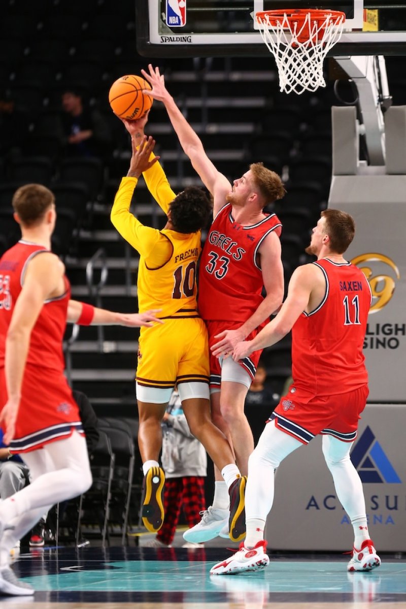 Men's basketball player Luke Barrett defends against Arizona State in November 2024