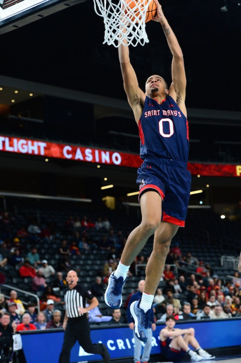 Mikey Lewis dunks against USC in November 2024