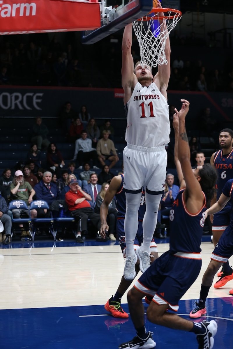 Men's basketball player Mitchell Saxen sinks a basket against UTSA in December 2024
