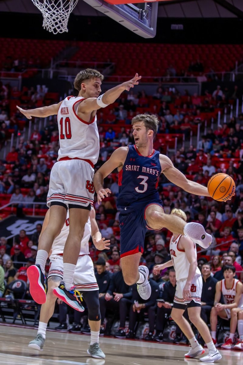 Men's basketball player Augustas Marciulionis jumps against Utah in December 2024