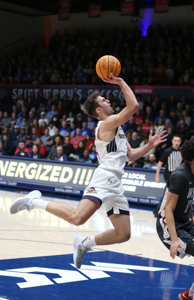 Augustas Marciulionis leaps with a basketball