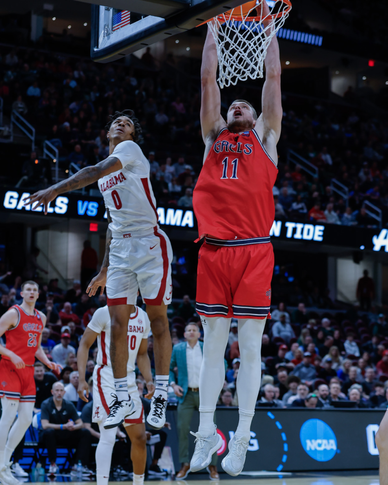 Men's basketball player Mitchell Saxen shoots against Alabama in the NCAA Tournament 2025