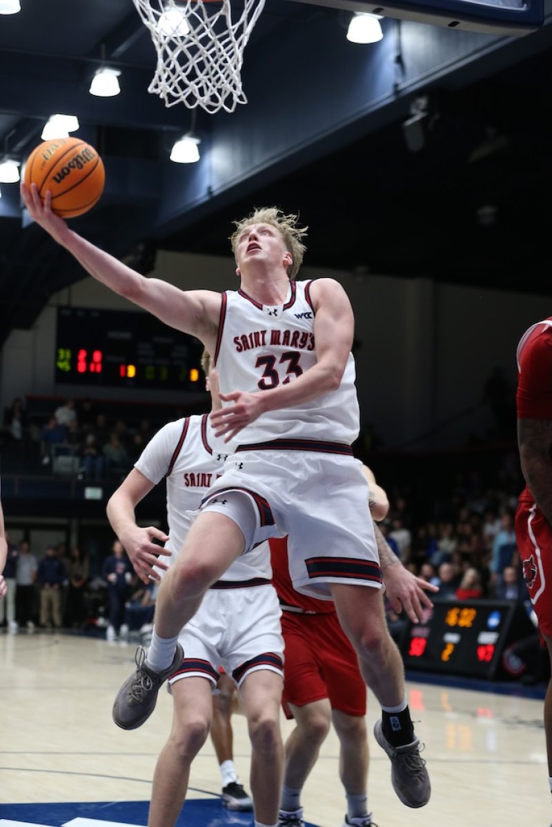 Basketball player Liam Campbell shoots against Arkansas State in November 2025