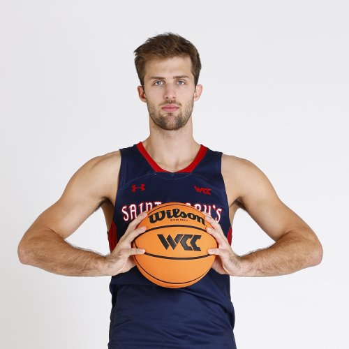 Men's Basketball player Augustas Marciulionis holding a basketball