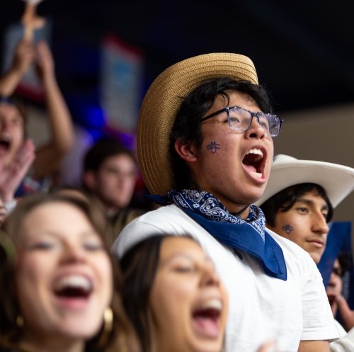 Students in Gael Force cheer for men's basketball as SMC plays Santa Clara in February 2025