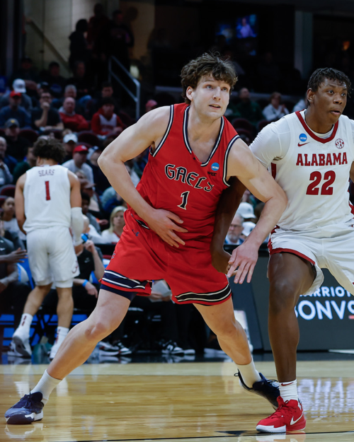 Men's basketball player Harry Wessels blocks against Alabama in the NCAA Tournament 2025