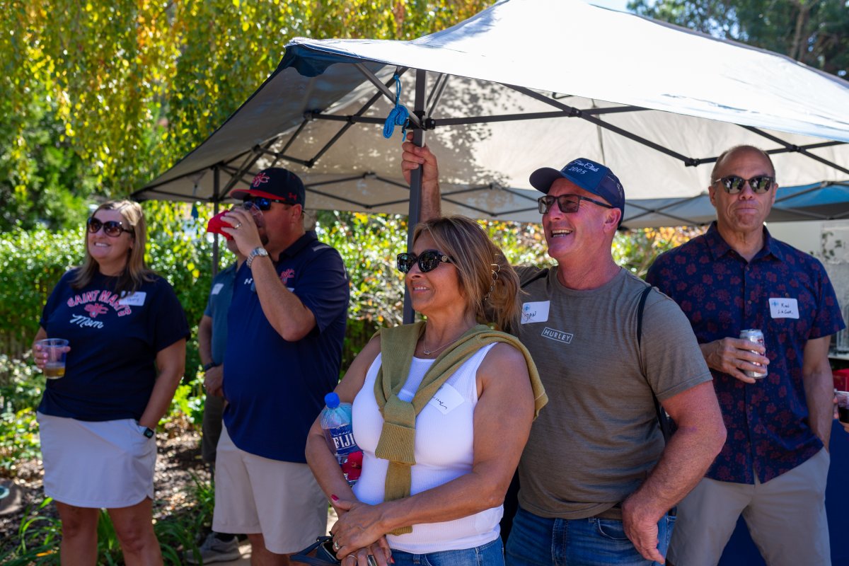 Parents smile and laugh at the President's Reception during Family Weekend