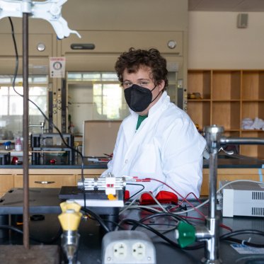 Science student in lab using light-responsive materials