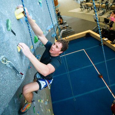 student climbing the wall