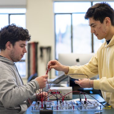 2 physics students working in the lab