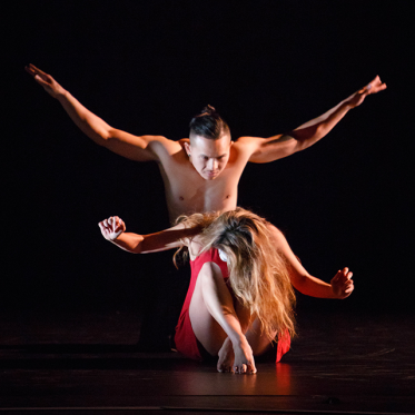 Male Dancer hovering over female dancer.