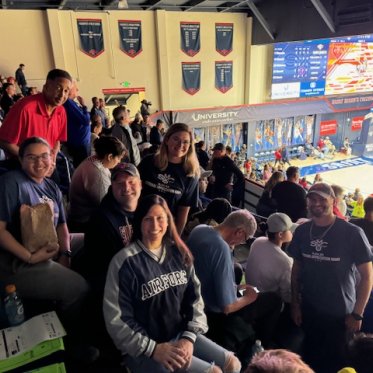 Veterans posing for  picture at SMC Veterans Appreciation Night basketball game