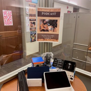 podcast flyer handed over a glass wall