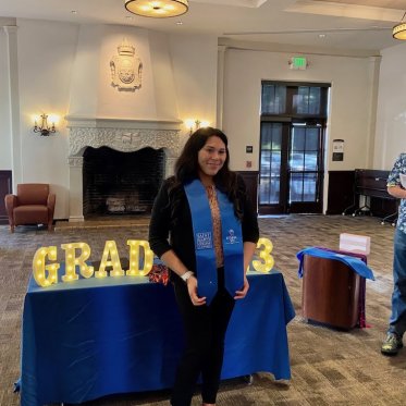 women wearing stole standing Infront of a table