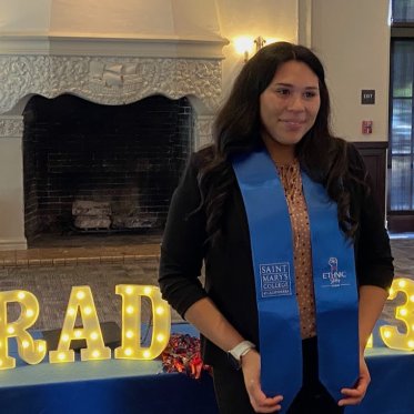 women wearing stole standing Infront of a table