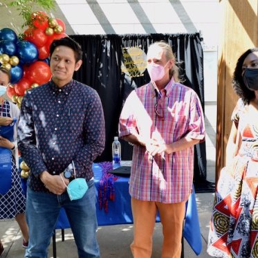 four people standing