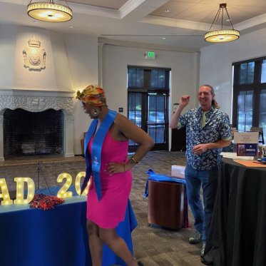 women wearing stole standing Infront of a table