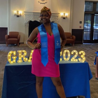 women wearing stole standing Infront of a table