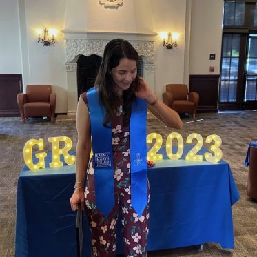 women wearing stole standing Infront of a table