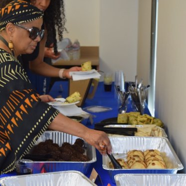 Women taking food onto her plate