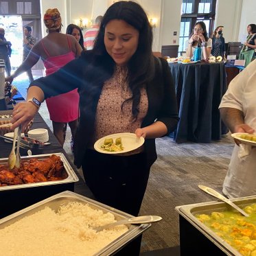 Women taking food onto her plate