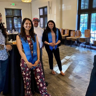 four people standing