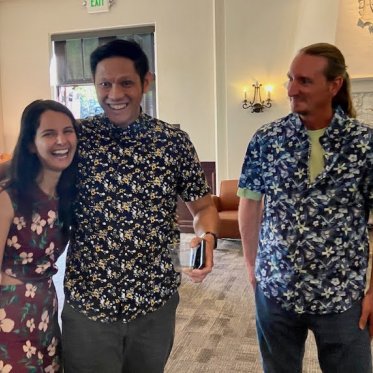 three people smiling