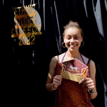 student holding a card