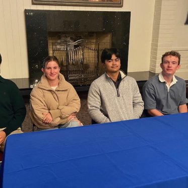 picture of five people sitting