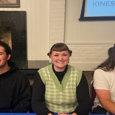 picture of 3 people sitting