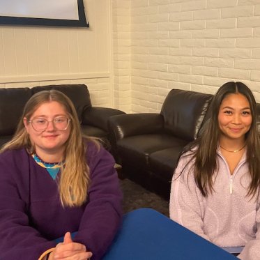 picture of 2 people sitting