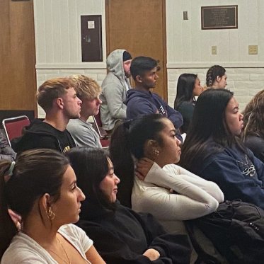 many people sitting and listening