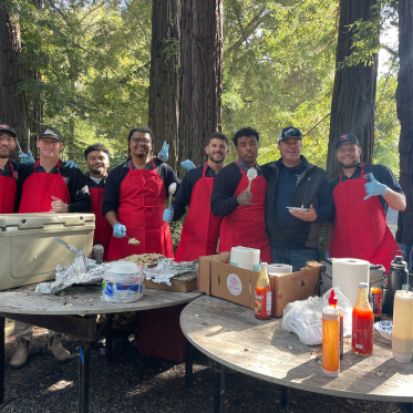 Teammates Serving After Match Meal
