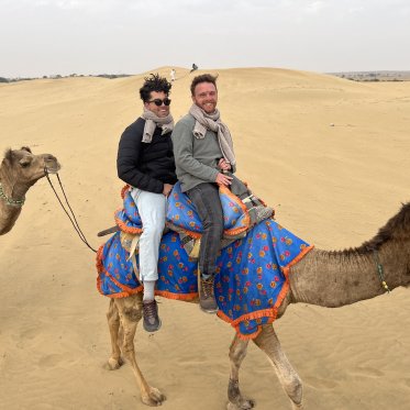 Students riding a camel