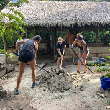 Students digging on site in Brazil