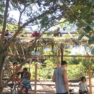 Students working in the shade in Brazil