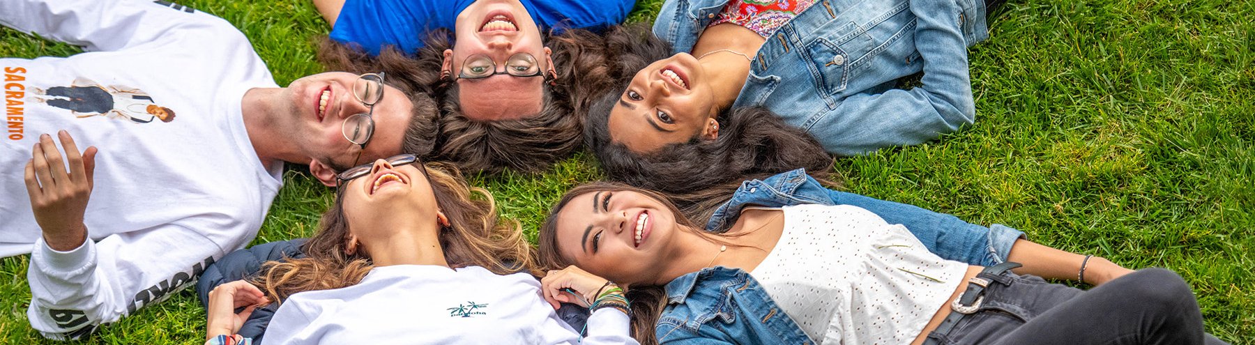 Kids laying outside during a sunny day