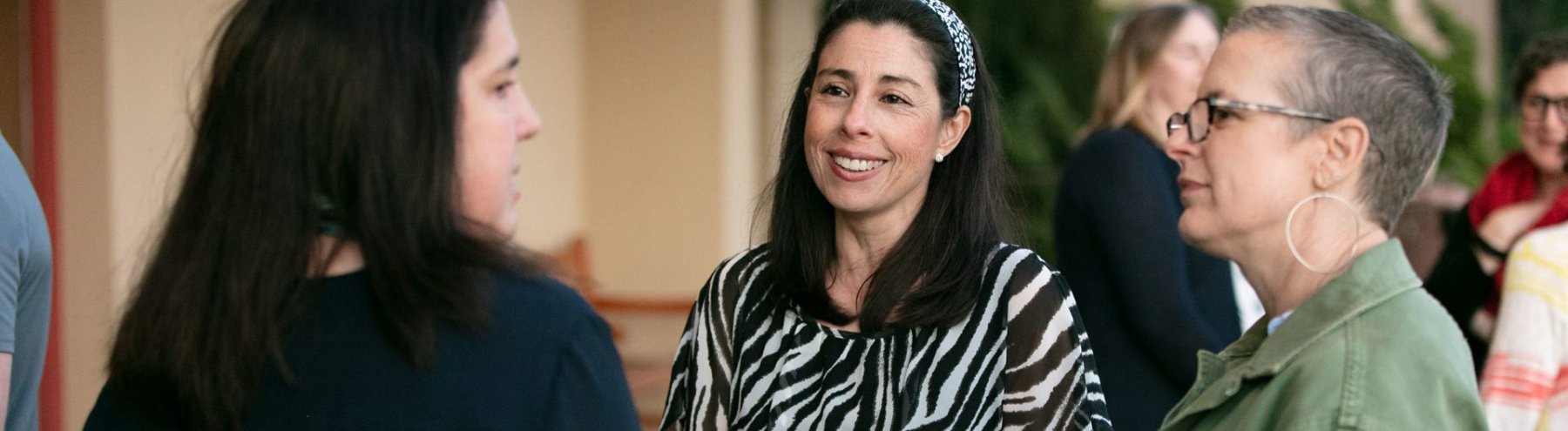 Three people talking