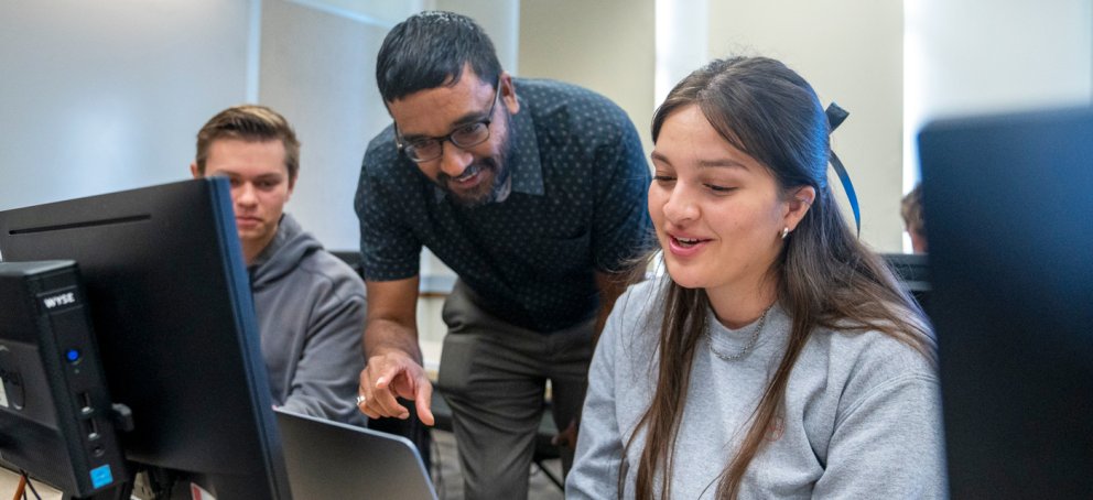 A professor demonstrating to a computer science class