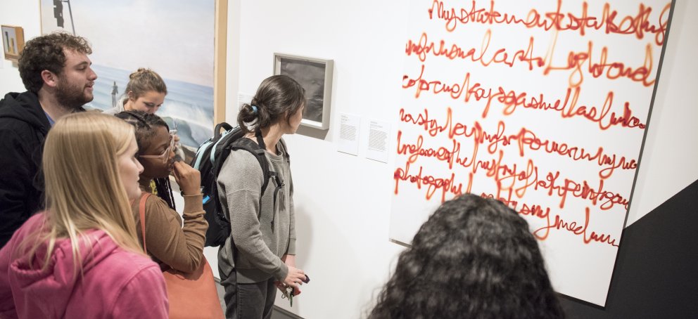 students looking at artwork 