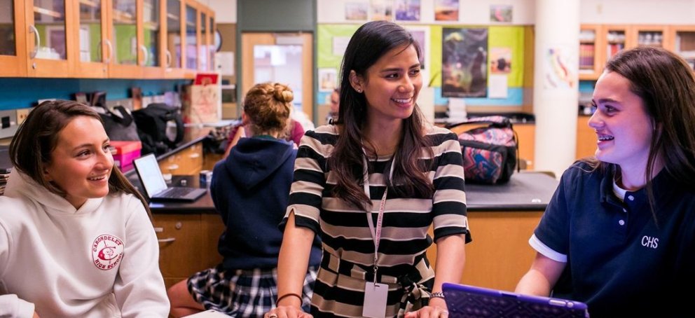 A teacher working with students