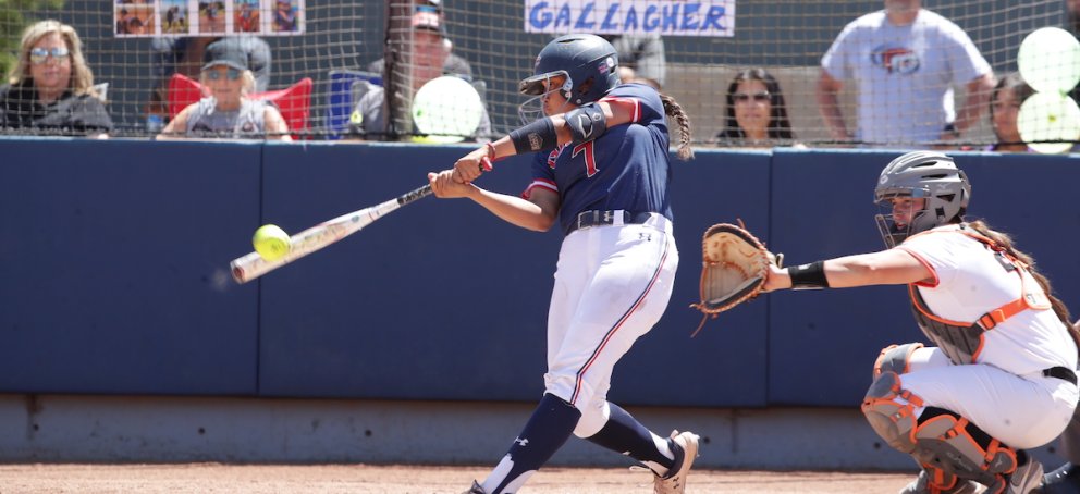 a softball player makes contact